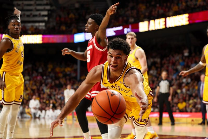 Jan 13, 2026; Minneapolis, Minnesota, USA; Minnesota Golden Gophers guard Isaac Asuma (1) dives for the ball against the Wisconsin Badgers during the second half at Williams Arena. Mandatory Credit: Matt Krohn-Imagn Images
