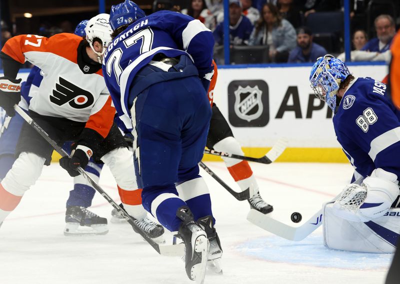 Mar 17, 2025; Tampa, Florida, USA;  Tampa Bay Lightning goaltender Andrei Vasilevskiy (88) skates a save against the Philadelphia Flyers during the second period at Amalie Arena. Mandatory Credit: Kim Klement Neitzel-Imagn Images