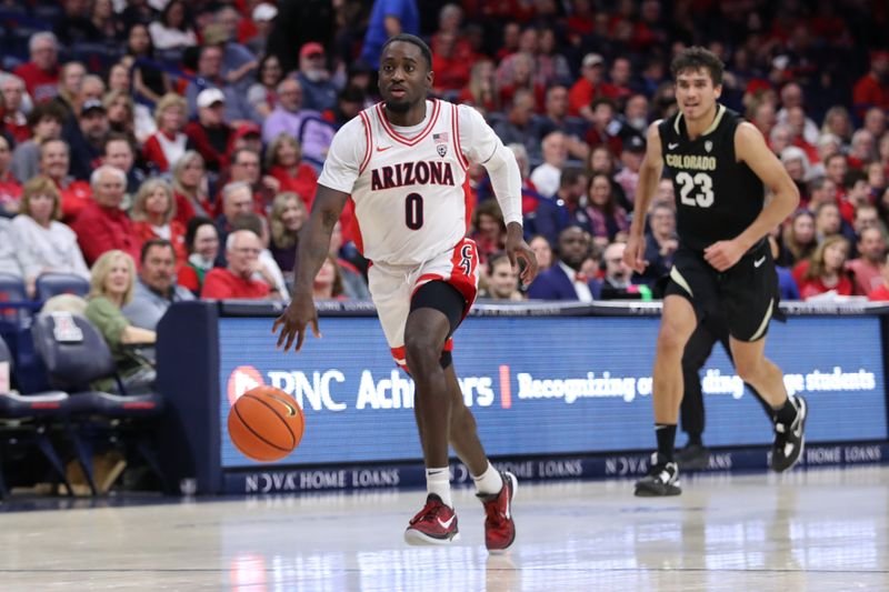 Feb 18, 2023; Tucson, Arizona, USA; Arizona Wildcats guard Courtney Ramey (0) dribbles down the court against Colorado Buffaloes forward Tristan da Silva (23) during the second half at McKale Center. Mandatory Credit: Zachary BonDurant-USA TODAY Sports