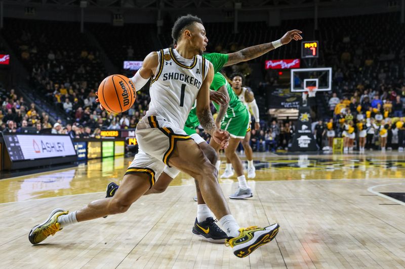 Jan 29, 2025; Wichita, Kansas, USA; Wichita State Shockers guard Xavier Bell (1) drives to the basket during the second half against the North Texas Mean Green at Charles Koch Arena. Mandatory Credit: William Purnell-Imagn Images