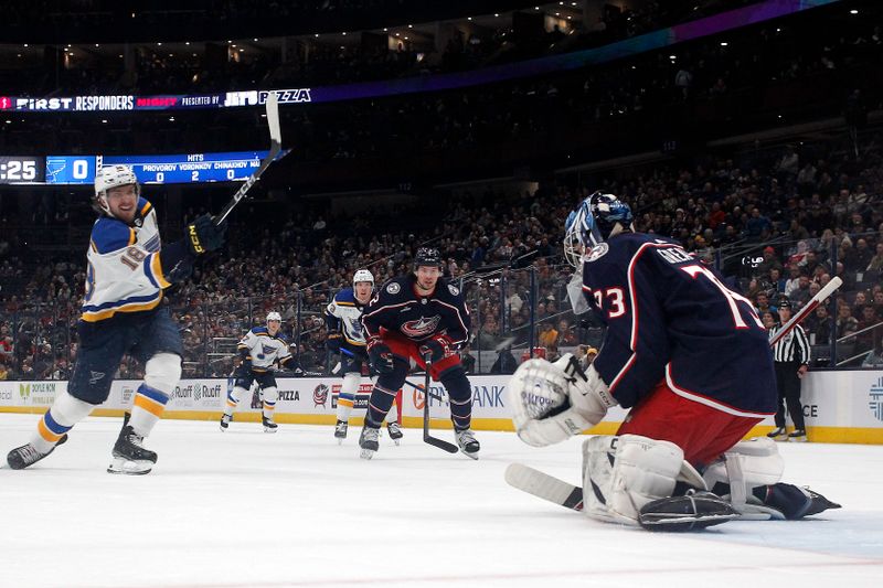 Dec 8, 2023; Columbus, Ohio, USA; St. Louis Blues center Robert Thomas (18) scores a goal against Columbus Blue Jackets goalie Jet Greaves (73) during the first period at Nationwide Arena. Mandatory Credit: Russell LaBounty-USA TODAY Sports