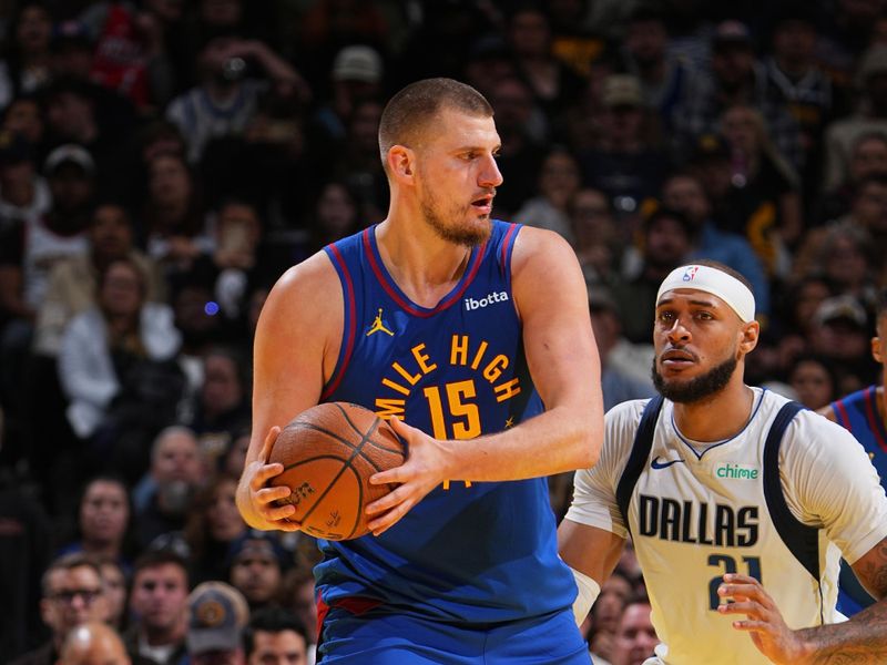 DENVER, CO - NOVEMBER 22: Nikola Jokic #15 of the Denver Nuggets looks to pass the ball during the game against the Dallas Mavericks during the Emirates NBA Cup game on November 22, 2024 at Ball Arena in Denver, Colorado. NOTE TO USER: User expressly acknowledges and agrees that, by downloading and/or using this Photograph, user is consenting to the terms and conditions of the Getty Images License Agreement. Mandatory Copyright Notice: Copyright 2024 NBAE (Photo by Garrett Ellwood/NBAE via Getty Images)