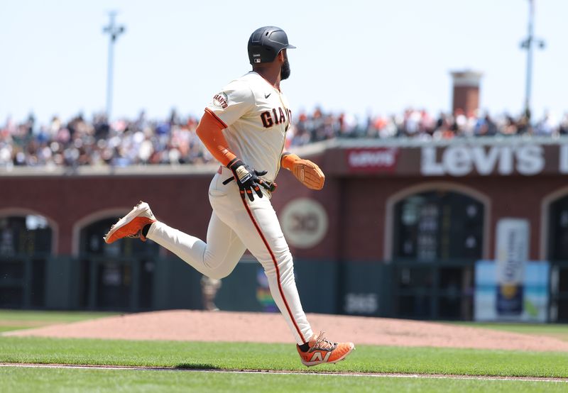 Jun 5, 2025; San Francisco, California, USA; San Francisco Giants designated hitter Heliot Ramos (17) runs home against the San Diego Padres during the third inning at Oracle Park. Mandatory Credit: Kelley L Cox-Imagn Images