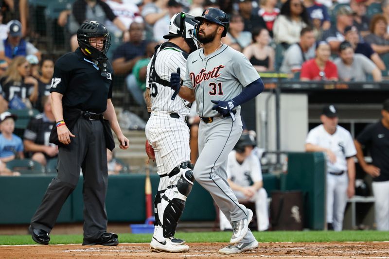 Aug 24, 2024; Chicago, Illinois, USA; Detroit Tigers outfielder Riley Greene (31) scores against the Chicago White Sox during the third inning at Guaranteed Rate Field. Mandatory Credit: Kamil Krzaczynski-USA TODAY Sports