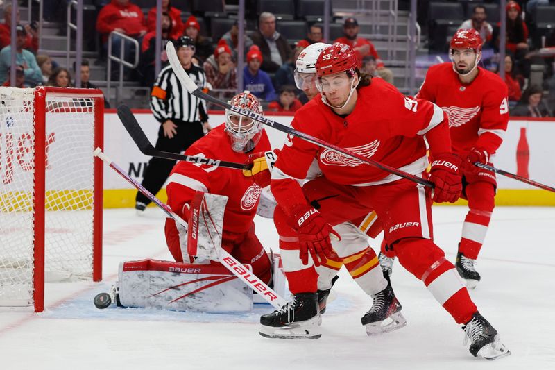 Oct 22, 2023; Detroit, Michigan, USA;  Detroit Red Wings goaltender James Reimer (47) makes the save in front of defenseman Moritz Seider (53) in the first period against the Calgary Flames at Little Caesars Arena. Mandatory Credit: Rick Osentoski-USA TODAY Sports