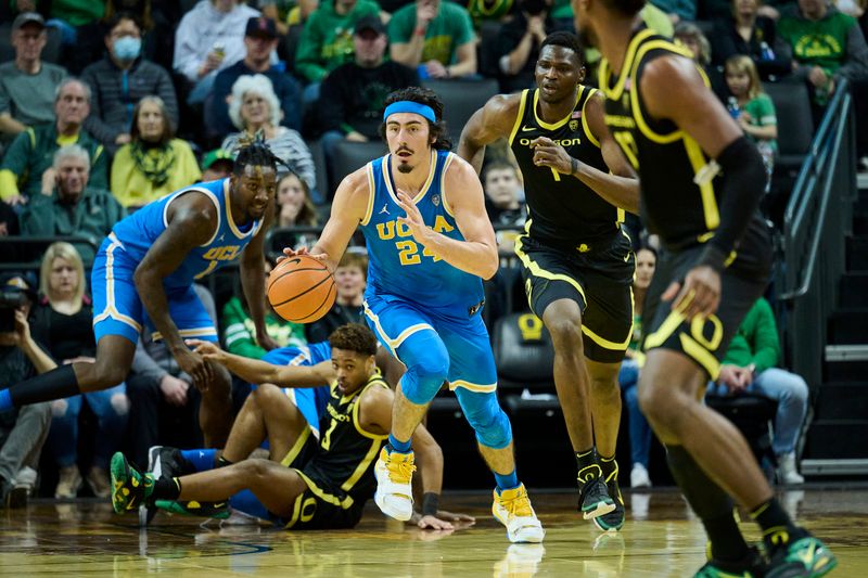 Feb 11, 2023; Eugene, Oregon, USA; UCLA Bruins guard Jaime Jaquez Jr. (24) dribbles the ball on a fast break during the second half against the Oregon Ducks at Matthew Knight Arena. Mandatory Credit: Troy Wayrynen-USA TODAY Sports