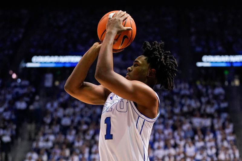 Feb 14, 2026; Provo, Utah, USA; BYU Cougars guard Robert Wright III (1) takes a three point shot during the first half against the Colorado Buffaloes at the Marriott Center. Mandatory Credit: Aaron Baker-Imagn Images