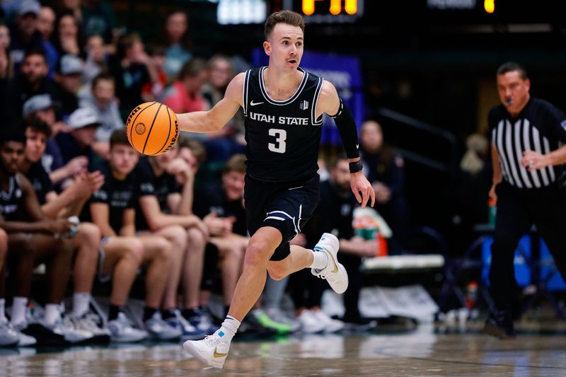 Feb 4, 2023; Fort Collins, Colorado, USA; Utah State Aggies guard Steven Ashworth (3) dribbles the ball up court in the first half against the Colorado State Rams at Moby Arena. Mandatory Credit: Isaiah J. Downing-USA TODAY Sports