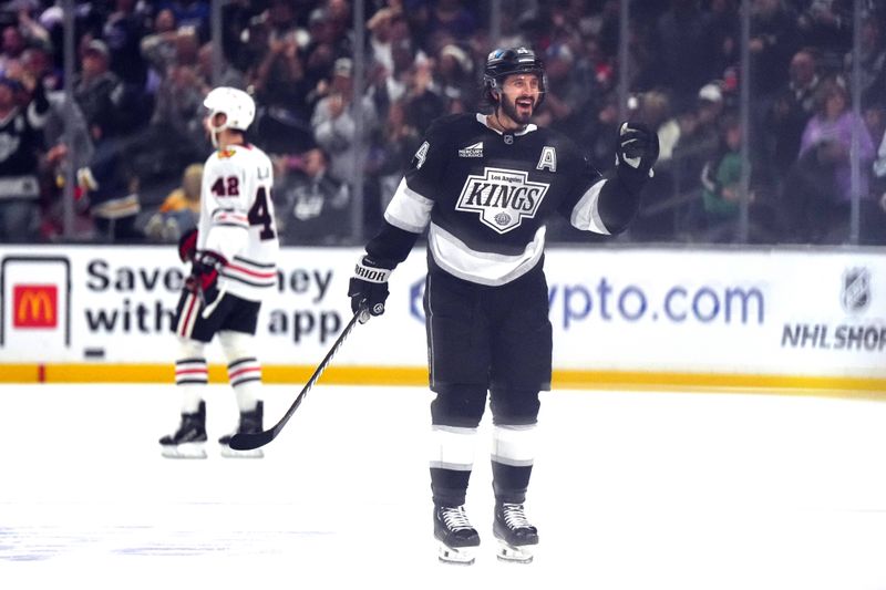 Nov 2, 2024; Los Angeles, California, USA; LA Kings center Phillip Danault (24) celebrates after a goal against the Chicago Blackhawks in the third period at Crypto.com Arena. Mandatory Credit: Kirby Lee-Imagn Images