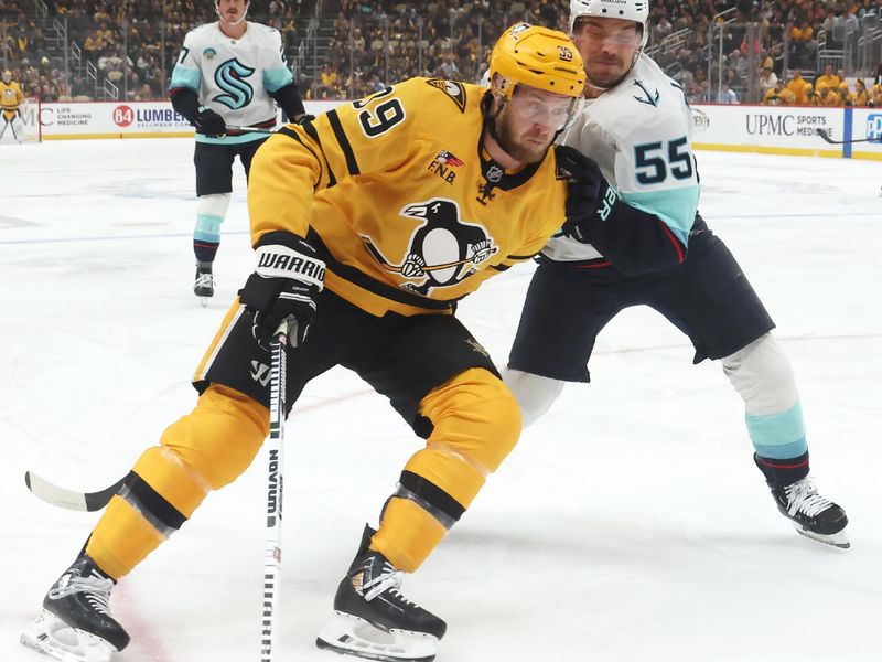 Nov 22, 2025; Pittsburgh, Pennsylvania, USA;  Pittsburgh Penguins right wing Anthony Mantha (39) skates with the puck against pressure from Seattle Kraken defenseman Ryan Lindgren (55) during the first period at PPG Paints Arena. Mandatory Credit: Charles LeClaire-Imagn Images