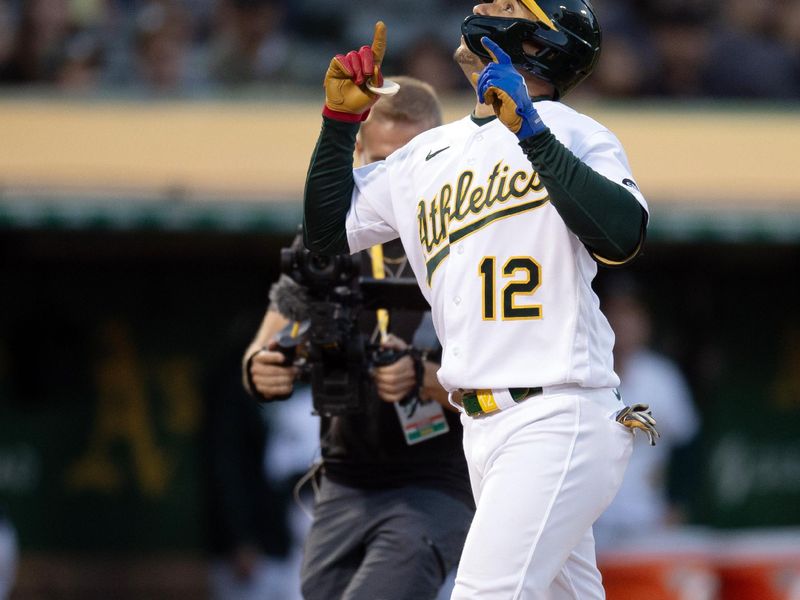 Aug 19, 2023; Oakland, California, USA; Oakland Athletics left fielder Aledmys D  az (12) celebrates his solo home run during the sixth inning at Oakland-Alameda County Coliseum. Mandatory Credit: D. Ross Cameron-USA TODAY Sports