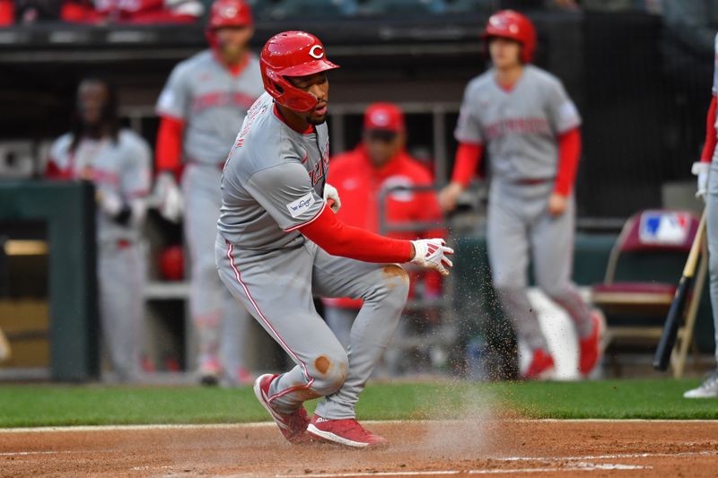 Apr 12, 2024; Chicago, Illinois, USA; Cincinnati Reds center fielder Will Benson (30) slides into home plate to score off a sacrifice fly against the Chicago White Sox during the first inning at Guaranteed Rate Field. Mandatory Credit: Patrick Gorski-USA TODAY Sports