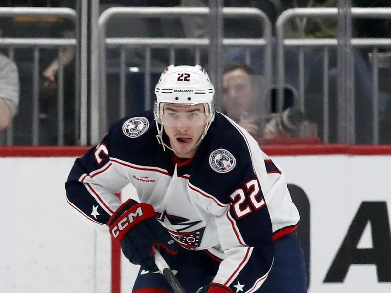 Mar 5, 2024; Pittsburgh, Pennsylvania, USA; Columbus Blue Jackets defenseman Jake Bean (22) skies up ice with the puck against the Pittsburgh Penguins during the second period at PPG Paints Arena. Mandatory Credit: Charles LeClaire-USA TODAY Sports