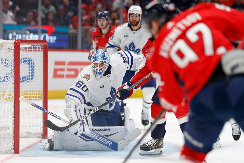 Oct 24, 2023; Washington, District of Columbia, USA; Toronto Maple Leafs goaltender Joseph Woll (60) makes a save on Washington Capitals center Evgeny Kuznetsov (92) in the third period at Capital One Arena. Mandatory Credit: Geoff Burke-USA TODAY Sports