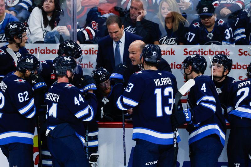 Oct 11, 2024; Winnipeg, Manitoba, CAN; Winnipeg Jets assistant coach discusses strategy against the Chicago Blackhawks during the third period at Canada Life Centre. Mandatory Credit: Terrence Lee-Imagn Images