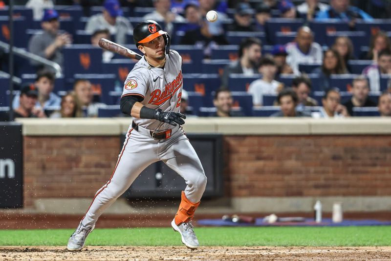 Aug 20, 2024; New York City, New York, USA;  Baltimore Orioles third baseman Ramón Urías (29) hits an RBI infield single in the fourth inning against the New York Mets at Citi Field. Mandatory Credit: Wendell Cruz-USA TODAY Sports