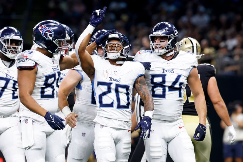 Tennessee Titans running back Tony Pollard celebrates after scoring against the New Orleans Saints during the first half of an NFL preseason football game , Sunday, Aug. 25, 2024, in New Orleans. (AP Photo/Butch Dill)