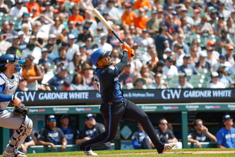 May 26, 2024; Detroit, Michigan, USA; Detroit Tigers second baseman Andy Ibáñez (77) hits during an at bat in the first inning of the game against the Toronto Blue Jays at Comerica Park. Mandatory Credit: Brian Bradshaw Sevald-USA TODAY Sports