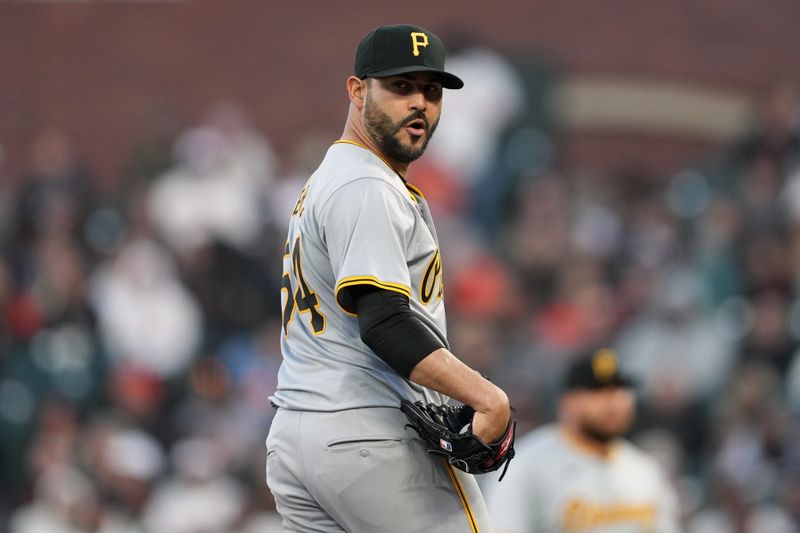 Apr 27, 2024; San Francisco, California, USA; Pittsburgh Pirates starting pitcher Martin Perez (54) reacts after a play at third base during the sixth inning against the San Francisco Giants at Oracle Park. Mandatory Credit: Darren Yamashita-USA TODAY Sports