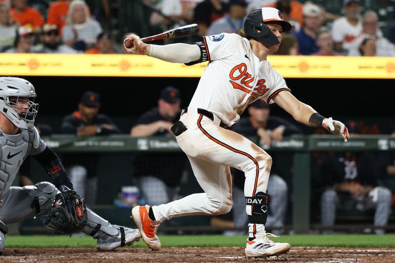Jun 10, 2025; Baltimore, Maryland, USA; Baltimore Orioles second baseman Jackson Holliday (7) hits a double during the eighth inning against the Detroit Tigers at Oriole Park at Camden Yards. Mandatory Credit: Daniel Kucin Jr.-Imagn Images