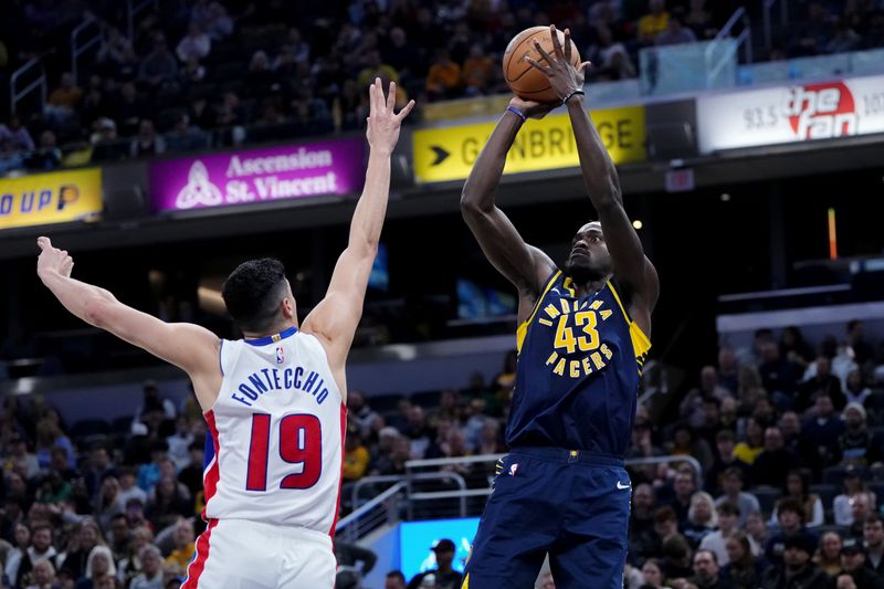 INDIANAPOLIS, INDIANA - FEBRUARY 22: Pascal Siakam #43 of the Indiana Pacers attempts a shot while being guarded by Simone Fontecchio #19 of the Detroit Pistons in the second quarter at Gainbridge Fieldhouse on February 22, 2024 in Indianapolis, Indiana. NOTE TO USER: User expressly acknowledges and agrees that, by downloading and or using this photograph, User is consenting to the terms and conditions of the Getty Images License Agreement. (Photo by Dylan Buell/Getty Images)