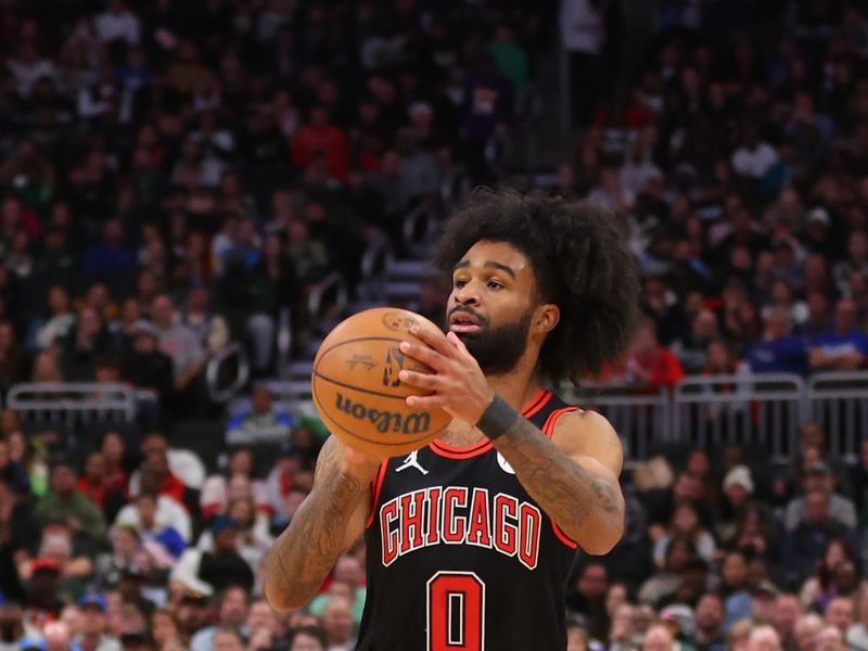 MILWAUKEE, WISCONSIN - NOVEMBER 13: Coby White #0 of the Chicago Bulls takes a three point shot during the first half of a game against the Milwaukee Bucks at Fiserv Forum on November 13, 2023 in Milwaukee, Wisconsin. NOTE TO USER: User expressly acknowledges and agrees that, by downloading and or using this photograph, User is consenting to the terms and conditions of the Getty Images License Agreement. (Photo by Stacy Revere/Getty Images)