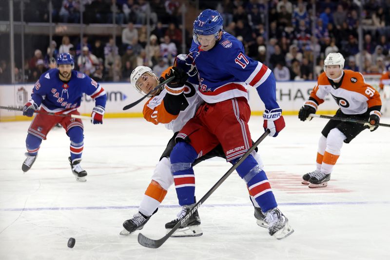 Dec 20, 2025; New York, New York, USA; New York Rangers defenseman Will Borgen (17) hits Philadelphia Flyers right wing Bobby Brink (10) during the third period at Madison Square Garden. Mandatory Credit: Brad Penner-Imagn Images