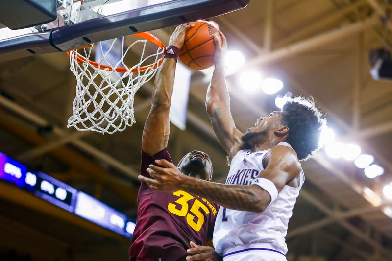 Jan 26, 2023; Seattle, Washington, USA; Arizona State Sun Devils guard Devan Cambridge (35) blocks a dunk attempt by Washington Huskies forward Keion Brooks (1) during the first half at Alaska Airlines Arena at Hec Edmundson Pavilion. Mandatory Credit: Joe Nicholson-USA TODAY Sports