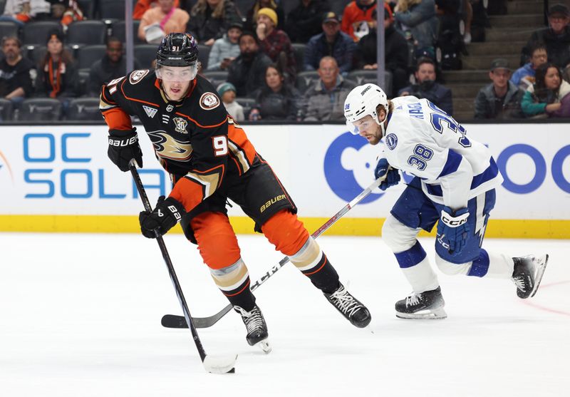 Mar 24, 2024; Anaheim, California, USA; Anaheim Ducks center Leo Carlsson (91) skates from Tampa Bay Lightning left wing Brandon Hagel (38) during the first period at Honda Center. Mandatory Credit: Jason Parkhurst-USA TODAY Sports