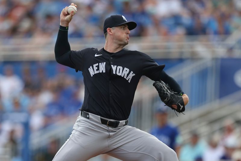 Mar 8, 2024; Dunedin, Florida, USA;  New York Yankees relief pitcher Clay Holmes (35) throws a pitch against the Toronto Blue Jays in the fifth inning at TD Ballpark. Mandatory Credit: Nathan Ray Seebeck-USA TODAY Sports