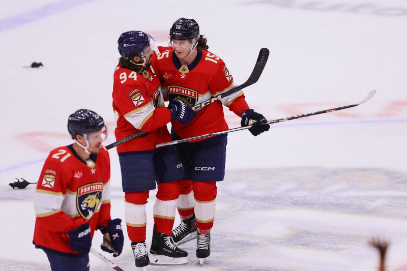 Apr 9, 2024; Sunrise, Florida, USA; Florida Panthers left wing Ryan Lomberg (94) and center Anton Lundell (15) celebrate after the game against the Ottawa Senators at Amerant Bank Arena. Mandatory Credit: Sam Navarro-USA TODAY Sports