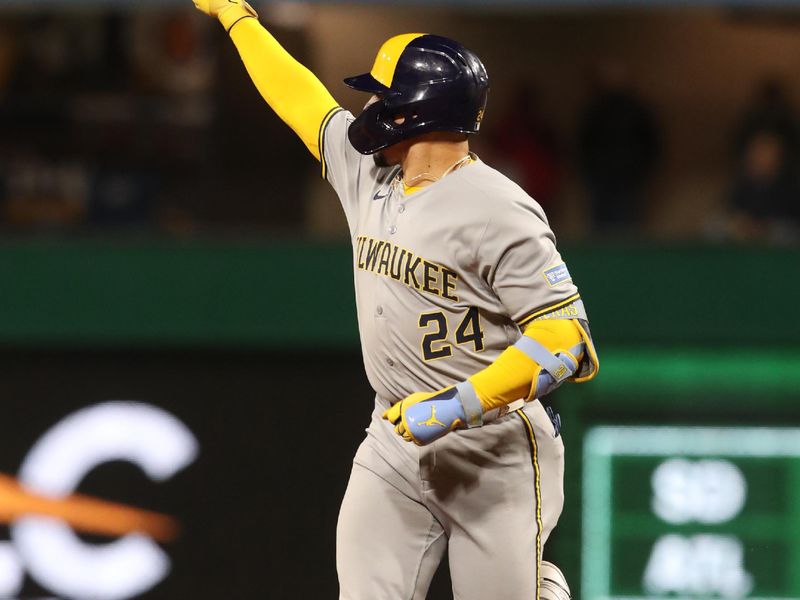 May 23, 2025; Pittsburgh, Pennsylvania, USA;  Milwaukee Brewers catcher William Contreras (24) gestures to the Brewers bullpen as he circles the bases on a solo home run against the Pittsburgh Pirates during the ninth inning at PNC Park. Mandatory Credit: Charles LeClaire-Imagn Images