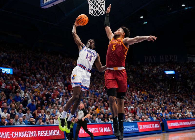 Jan 13, 2026; Lawrence, Kansas, USA; Kansas Jayhawks guard Melvin Council Jr. (14) attempts to dunk against Iowa State Cyclones forward Joshua Jefferson (5) during the second half at Allen Fieldhouse. Mandatory Credit: Jay Biggerstaff-Imagn Images