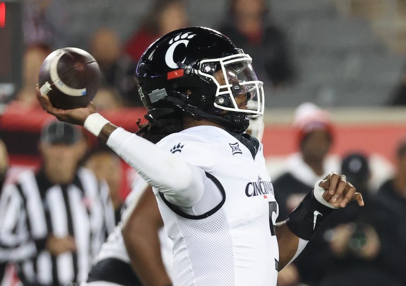 Nov 11, 2023; Houston, Texas, USA; Cincinnati Bearcats quarterback Emory Jones (5) passes against the Houston Cougars in the first half at TDECU Stadium. Mandatory Credit: Thomas Shea-USA TODAY Sports