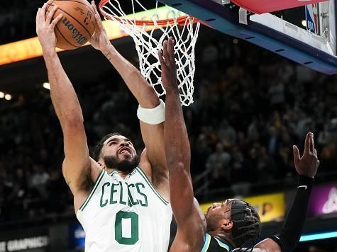 INDIANAPOLIS, INDIANA - DECEMBER 04: Jayson Tatum #0 of the Boston Celtics attempts a shot while being guarded by Buddy Hield #7 of the Indiana Pacers in the fourth quarter during the NBA In-Season Tournament at Gainbridge Fieldhouse on December 04, 2023 in Indianapolis, Indiana. NOTE TO USER: User expressly acknowledges and agrees that, by downloading and or using this photograph, User is consenting to the terms and conditions of the Getty Images License Agreement. (Photo by Dylan Buell/Getty Images)