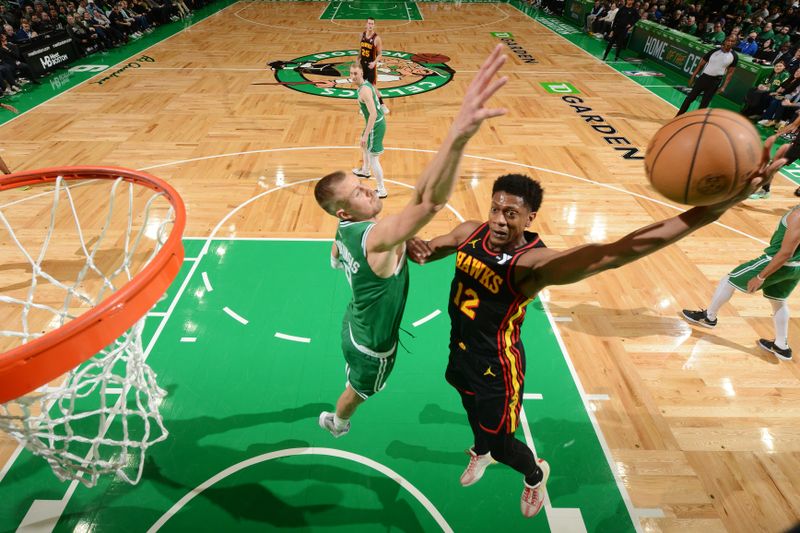 BOSTON, MA - FEBRUARY 7: De'Andre Hunter #12 of the Atlanta Hawks drives to the basket during the game against the Boston Celtics on February 7, 2024 at the TD Garden in Boston, Massachusetts. NOTE TO USER: User expressly acknowledges and agrees that, by downloading and or using this photograph, User is consenting to the terms and conditions of the Getty Images License Agreement. Mandatory Copyright Notice: Copyright 2024 NBAE  (Photo by Brian Babineau/NBAE via Getty Images)