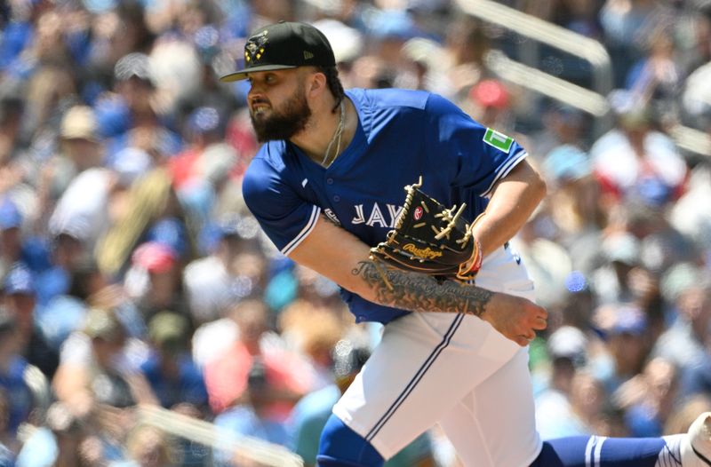 May 19, 2024; Toronto, Ontario, CAN;   Toronto Blue Jays starting pitcher Alek Manoah (6) delivers a pitch against the Tampa Bay Rays in the second inning at Rogers Centre. Mandatory Credit: Dan Hamilton-USA TODAY Sports