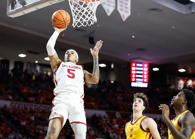 Jan 6, 2024; Norman, Oklahoma, USA; Oklahoma Sooners guard Rivaldo Soares (5) shoots against the Iowa State Cyclones during the second half at Lloyd Noble Center. Mandatory Credit: Alonzo Adams-USA TODAY Sports