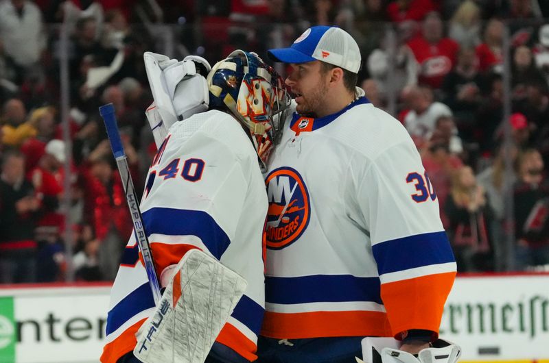 Apr 30, 2024; Raleigh, North Carolina, USA; New York Islanders goaltender Semyon Varlamov (40) and  goaltender Ilya Sorokin (30) greet each other after the loss to the Carolina Hurricanes in game five of the first round of the 2024 Stanley Cup Playoffs at PNC Arena. Mandatory Credit: James Guillory-USA TODAY Sports