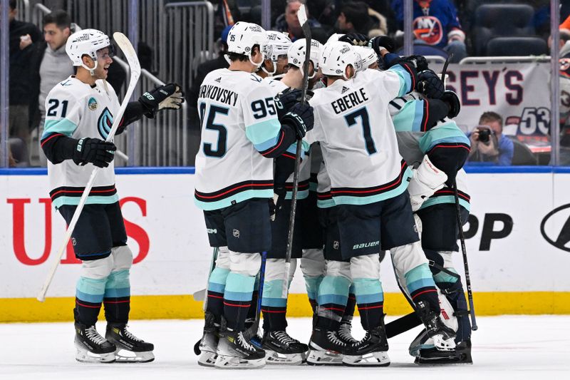 Feb 13, 2024; Elmont, New York, USA; Seattle Kraken celebrate the victory against the New York Islanders after shoot outs  at UBS Arena. Mandatory Credit: Dennis Schneidler-USA TODAY Sports