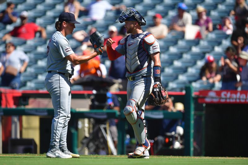 Jun 27, 2024; Anaheim, California, USA; Detroit Tigers pitcher Tyler Holton (87) and catcher Carson Kelly (15) celebrate the victory against the Los Angeles Angels at Angel Stadium. Mandatory Credit: Gary A. Vasquez-USA TODAY Sports