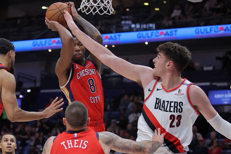 NEW ORLEANS, LOUISIANA - NOVEMBER 04: Jamal Cain #8 of the New Orleans Pelicans rebounds the ball against Donovan Clingan #23 of the Portland Trail Blazers during the first half at Smoothie King Center on November 04, 2024 in New Orleans, Louisiana. NOTE TO USER: User expressly acknowledges and agrees that, by downloading and or using this Photograph, user is consenting to the terms and conditions of the Getty Images License Agreement. (Photo by Jonathan Bachman/Getty Images)