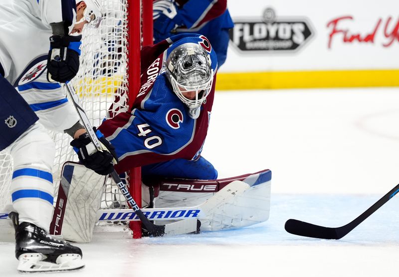 Apr 28, 2024; Denver, Colorado, USA; Colorado Avalanche goaltender Alexandar Georgiev (40) makes a save on Winnipeg Jets center Mason Appleton (22) during the third period in game four of the first round of the 2024 Stanley Cup Playoffs at Ball Arena. Mandatory Credit: Ron Chenoy-USA TODAY Sports