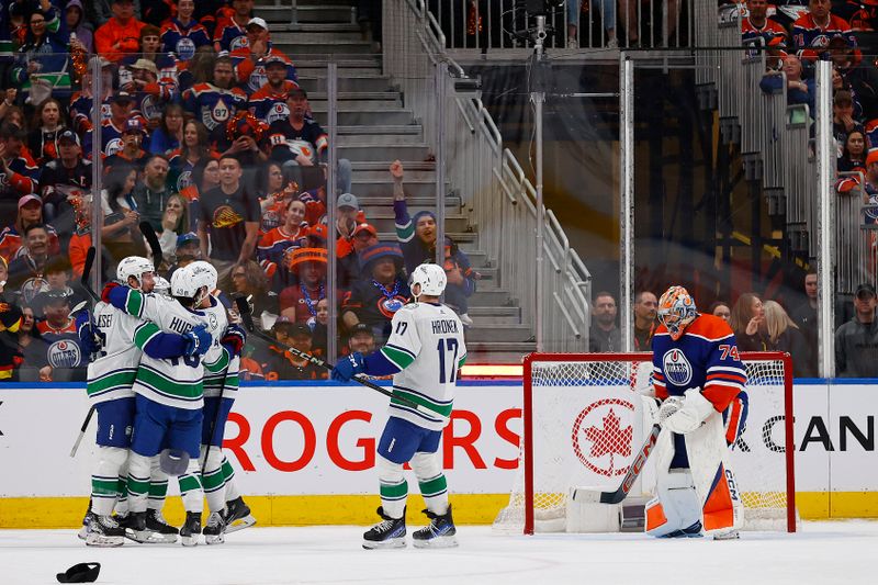 May 12, 2024; Edmonton, Alberta, CAN;The Vancouver Canucks celebrate a goal by  forward Brock Boeser (6), his third goal of the game during the first period against the Edmonton Oilers in game three of the second round of the 2024 Stanley Cup Playoffs at Rogers Place. Mandatory Credit: Perry Nelson-USA TODAY Sports