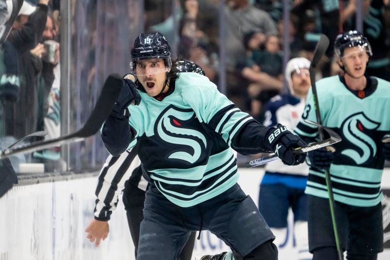 Nov 13, 2022; Seattle, Washington, USA; Seattle Kraken forward Brandon Tanev (13) celebrates after scoring a goal during the third period against the Winnipeg Jets at Climate Pledge Arena. Mandatory Credit: Stephen Brashear-USA TODAY Sports