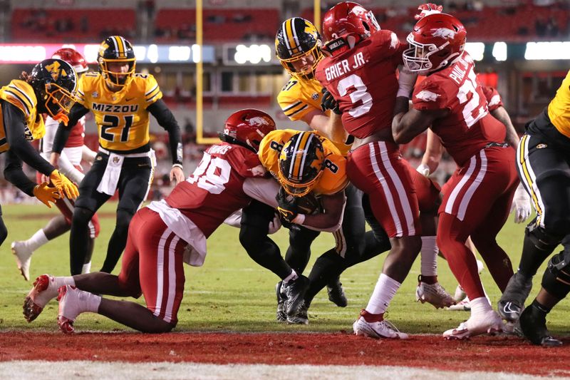 Nov 24, 2023; Fayetteville, Arkansas, USA; Missouri Tigers running back Nate Peat (8) scores a touchdown in the fourth quarter against the Arkansas Razorbacks at Donald W. Reynolds Razorback Stadium. Missouri won 48-14. Mandatory Credit: Nelson Chenault-USA TODAY Sports