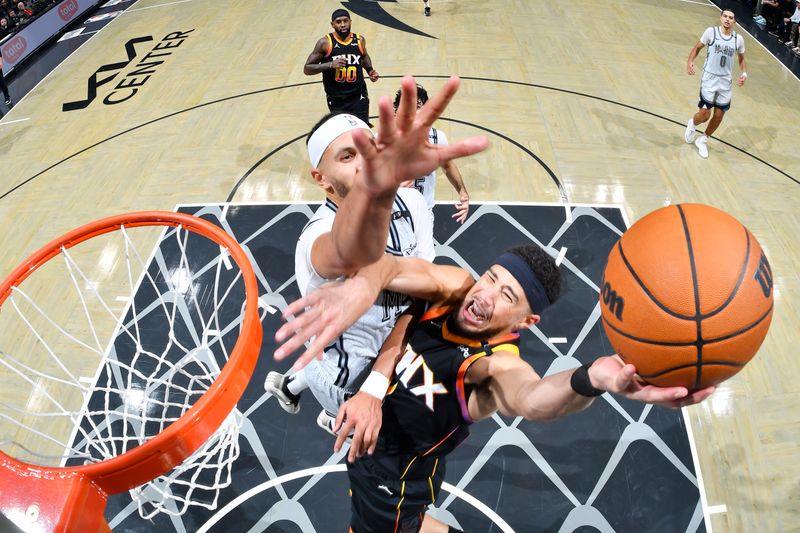 ORLANDO, FL - DECEMBER 8: Devin Booker #1 of the Phoenix Suns drives to the basket during the game against the Orlando Magic n December 8, 2024 at Amway Center in Orlando, Florida. NOTE TO USER: User expressly acknowledges and agrees that, by downloading and or using this photograph, User is consenting to the terms and conditions of the Getty Images License Agreement. Mandatory Copyright Notice: Copyright 2024 NBAE (Photo by Fernando Medina/NBAE via Getty Images)