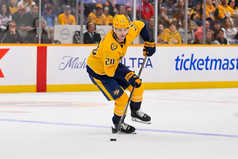 Mar 28, 2026; Nashville, Tennessee, USA;  Nashville Predators defenseman Justin Barron (20) skates with the puck against the Montreal Canadiens during the third period Gat Bridgestone Arena. Mandatory Credit: Steve Roberts-Imagn Images