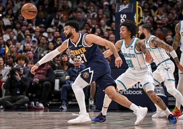 DENVER, CO - JANUARY 1: Jamal Murray (27) of the Denver Nuggets runs towards the ball after losing it while working against Nick Smith Jr. (8) of the Charlotte Hornets during the second quarter at Ball Arena in Denver on Monday, January 1, 2024. (Photo by AAron Ontiveroz/The Denver Post)