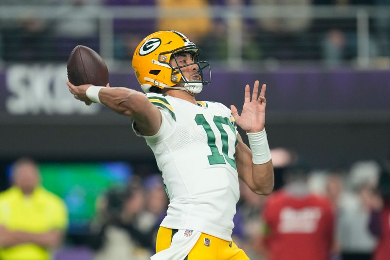 Green Bay Packers' Jordan Love thorws during the first half of an NFL football game against the Minnesota Vikings Sunday, Dec. 31, 2023, in Minneapolis. (AP Photo/Abbie Parr)